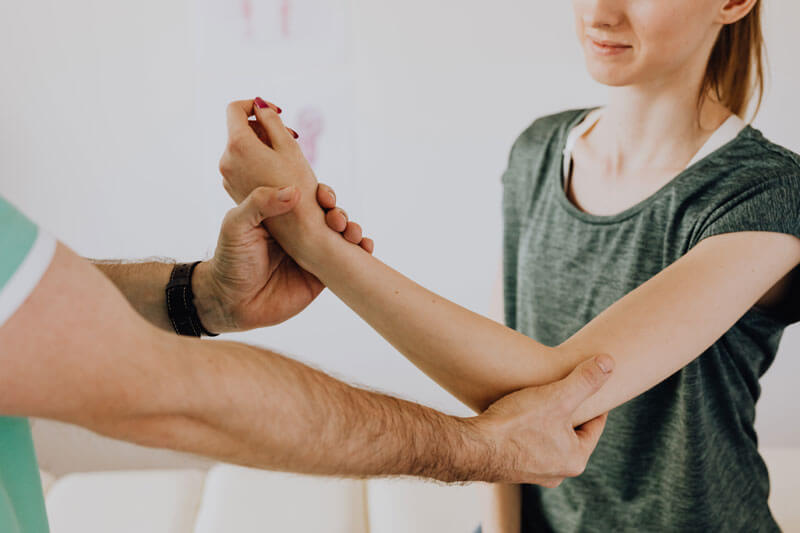 Woman getting physical therapy for her arm.