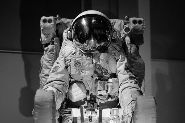 NASA astronaut sitting in space shuttle